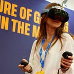 A person using VR headsets at Land Vegas booth