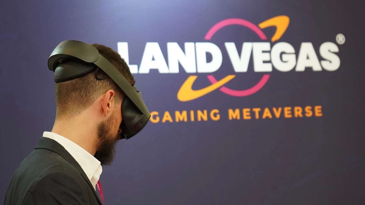 Person using VR headsets at Land Vegas booth in SBC Summit Barcelona