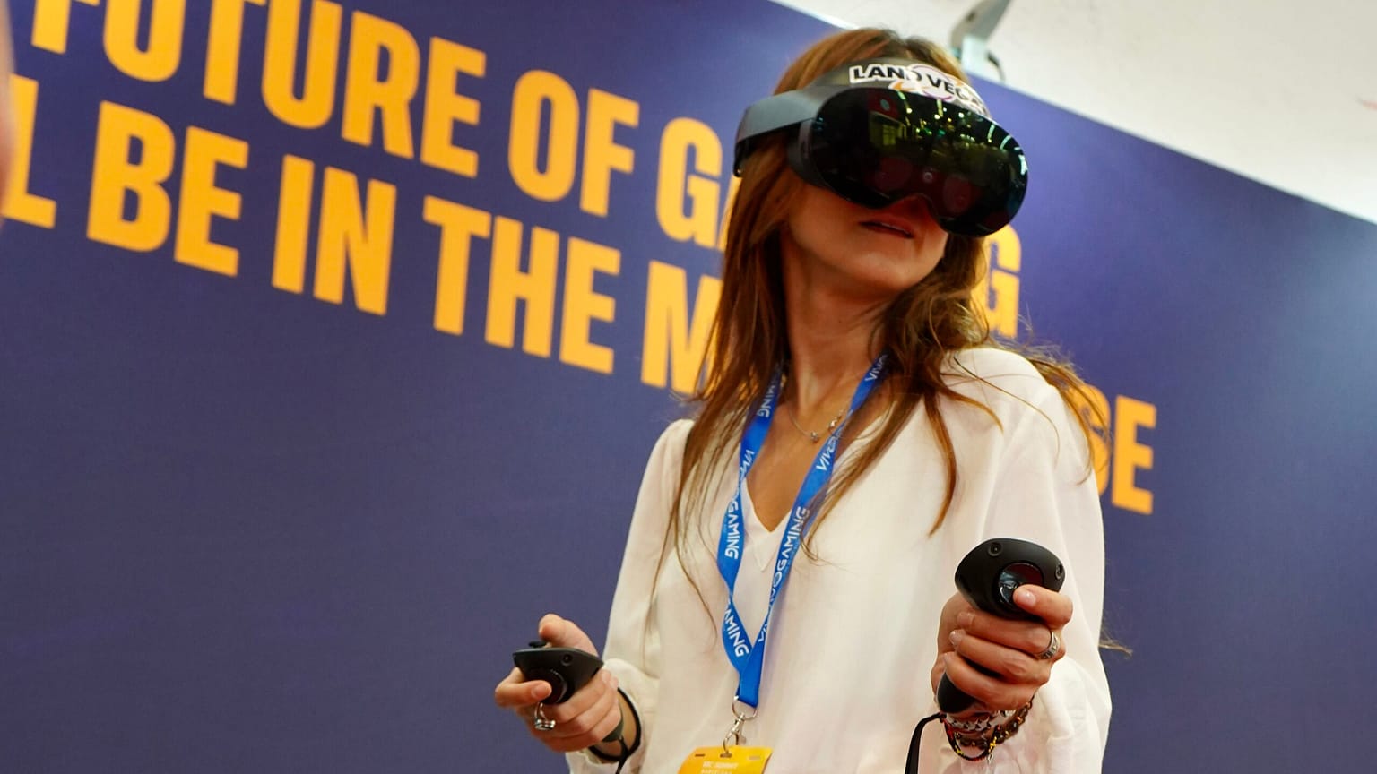 A person using VR headsets at Land Vegas booth